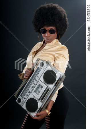 African American soul, jazz or blues singer with a vintage cassette player 88455891