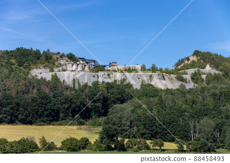 A quarry at the top of a mined hill A quarry at the top of a mined hill 88458493