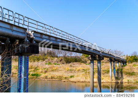 Old water pipe bridge over the river and the natural environment of the riverbed b-1 88459298
