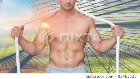 Light spot against mid section of caucasian fit man with a rope against sports field Light spot against mid section of caucasian fit man with a rope against sports field 88463528