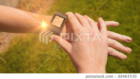 Light spot against close up of person using a smartwatch Light spot against close up of person using a smartwatch 88463530