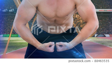 Mid section of caucasian fit man flexing against digital waves and sports field Mid section of caucasian fit man flexing against digital waves and sports field 88463535