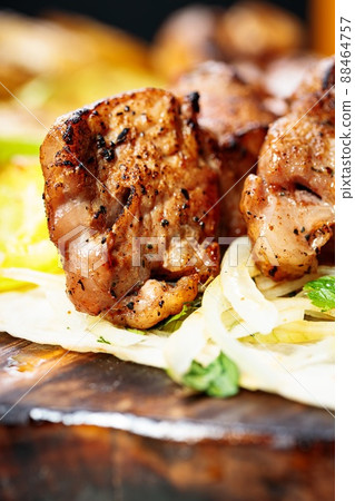 Appetizing grilled meat. Assorted vegetables. Close-up. Vertical shot. Copy space 88464757