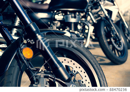 Bike touring Bikes parked side by side d-3 Around the front wheels that shine in the sunlight Warm and cool colors emphasized Bike touring Bikes parked side by side d-3 Around the front wheels that shine in the sunlight Warm and cool colors emphasized 88470236