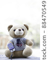 vertical photo teddy bears sitting on a wooden floor using Fingertip Pulse Oximeter to measure blood oxygen. Health concept. 88470549