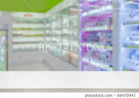 Empty white counter with pharmacy drugstore shelves blurred background 88470941