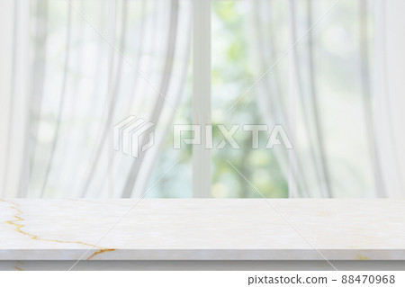 Marble table top on blur room interior with window curtain background Marble table top on blur room interior with window curtain background 88470968