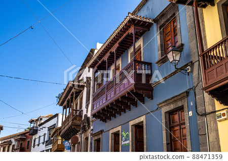 Teror at Gran Canaria, Spain. A beautiful traditional town with colorful houses with wooden balconies Teror at Gran Canaria, Spain. A beautiful traditional town with colorful houses with wooden balconies 88471359