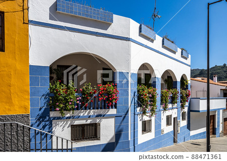 Teror at Gran Canaria, Spain. A beautiful traditional town with colorful houses with wooden balconies Teror at Gran Canaria, Spain. A beautiful traditional town with colorful houses with wooden balconies 88471361