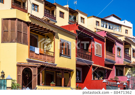Teror at Gran Canaria, Spain. A beautiful traditional town with colorful houses with wooden balconies Teror at Gran Canaria, Spain. A beautiful traditional town with colorful houses with wooden balconies 88471362