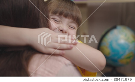 little girl daughter hugs her beloved mother. happy family. childhood dream life. child education of a small kid family. childhood in mother's arms. baby daughter love mommy. parent patronize child little girl daughter hugs her beloved mother. happy family. childhood dream life. child education of a small kid family. childhood in mother's arms. baby daughter love mommy. parent patronize child 88471979