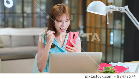woman earn money by phone woman earn money by phone 88472574