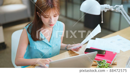 woman use laptop in office woman use laptop in office 88472575