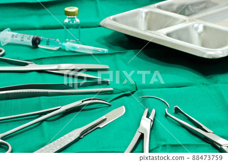 Surgical Instruments on the Table in Operating Room with syringe, vial and tray Surgical Instruments on the Table in Operating Room with syringe, vial and tray 88473759