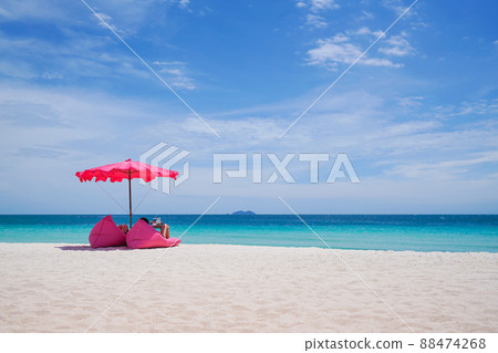 Pink parasol and seat on the tropical beach Pink parasol and seat on the tropical beach 88474268