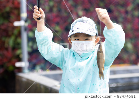 Girl enjoying fishing 88474581