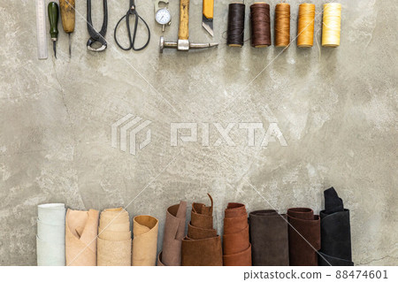 Top view materials and instruments on cutting mat for chopping measurement leatherwork details 88474601