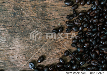 Roasted coffee bean flat lay on wood background Roasted coffee bean flat lay on wood background 88475974