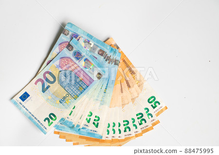 20 and 50 euro money note bill spread on white background 88475995