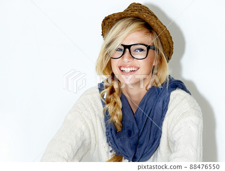 Living in the moment. Cropped studio portrait of a beautiful young woman in a hipster outfit. 88476550