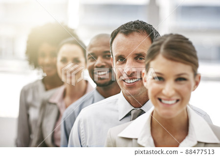 The stars are aligned. Cropped portrait of a group of coworkers standing a row. 88477513