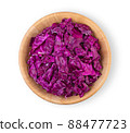 slice purple cabbage in wood bowl isolated on white background. top view 88477723