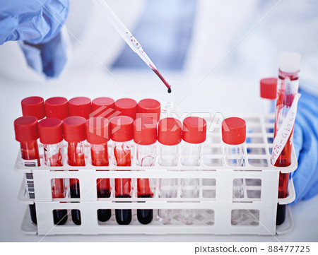 DNA never lies. Cropped shot of a lab technician holding vials of blood. 88477725