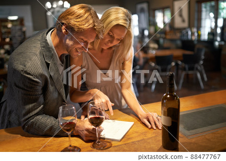 this was a good year. Shot of a couple enjoying a wine tasting. 88477767