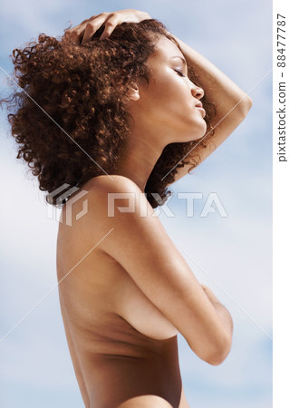 Passionate posing. Passionate topless woman posing outdoors. 88477787