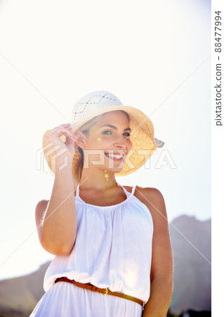 Styled for summer. Portrait of a beautiful young woman enjoying a bright summers day outdoors. Styled for summer. Portrait of a beautiful young woman enjoying a bright summers day outdoors. 88477994