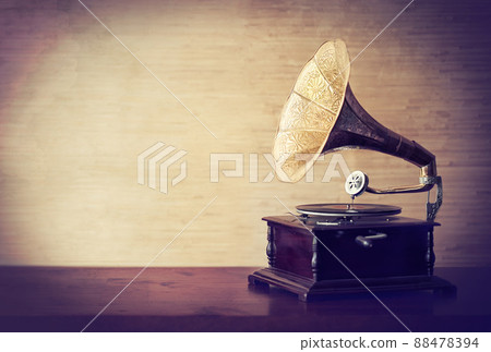 Getting lost in the music of old. Vintage style shot of a gramophone. 88478394