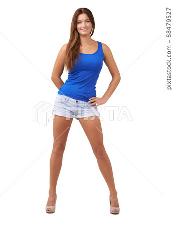 Cool and casual. Full length shot of an attractive young woman isolated on white. 88479527