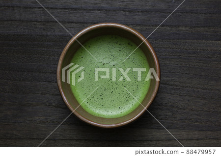 Matcha and bowl on a wooden table Matcha and bowl on a wooden table 88479957