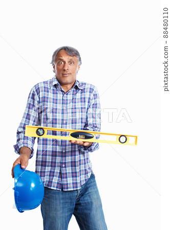 Surprised architect with spirit-level. Portrait of surprised architect holding spirit-level over white background. Surprised architect with spirit-level. Portrait of surprised architect holding spirit-level over white background. 88480110