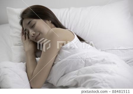 Asian woman sleep and sweet dream on bed in bedroom in the morning feeling so relax and comfortable Asian woman sleep and sweet dream on bed in bedroom in the morning feeling so relax and comfortable 88481511