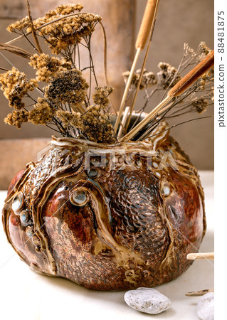Dry twigs bouquet in ceramic vase 88481875