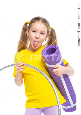 Little cute girl with hula hoop and gym mat. Isolated on white background. Little cute girl with hula hoop and gym mat. Isolated on white background. 88482192