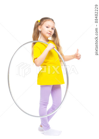 Little cute girl with hula hoop. Isolated on white background. Little cute girl with hula hoop. Isolated on white background. 88482229