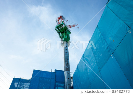 Image of tower crane at condominium construction site Image of tower crane at condominium construction site 88482773