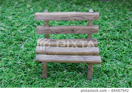 Miniature bench placed on artificial turf Miniature bench placed on artificial turf 88487942