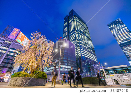 Tokyo cityscape of Japan Overlooking Tokyo Midtown Yaesu and weeping cherry trees in front of Tokyo station = April 7 88487948