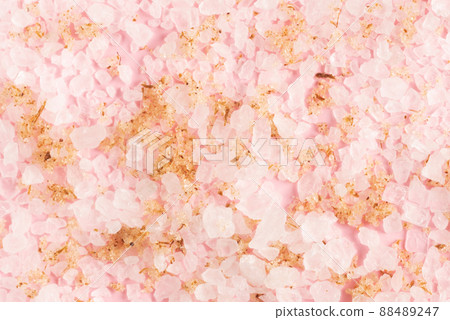 Sea salt texture close up on pink background 88489247
