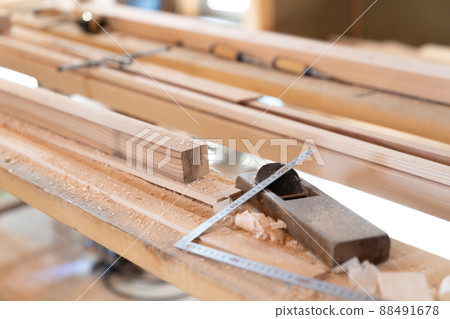 Planes and wood placed at the construction site 88491678