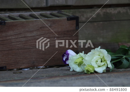 Toho Shrine's offering box and flowers [at Narita Airport Toho Shrine, Narita City, Chiba Prefecture] 88491800