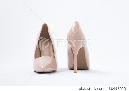 Elegant beige women's shoes with high heels. White background. Polished leather. back view Elegant beige women's shoes with high heels. White background. Polished leather. back view 88492033