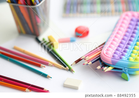 Stationery pencils wash and multicolored pencil case closeup Stationery pencils wash and multicolored pencil case closeup 88492355