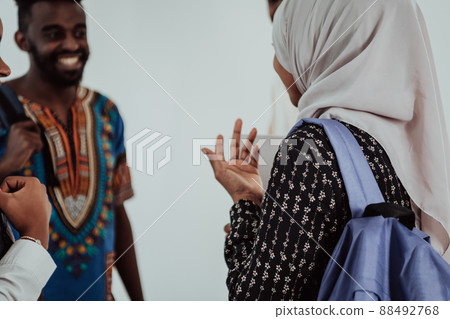 Group of happy african students having conversation and team meeting working together on homework girls wearing traidiional sudan muslim hijab fashion Group of happy african students having conversation and team meeting working together on homework girls wearing traidiional sudan muslim hijab fashion 88492768