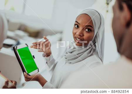 Group of happy african students having conversation and team meeting working together on homework girls wearing traidiional sudan muslim hijab fashion 88492854