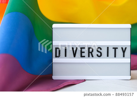 Rainbow flag with lightbox and text DIVERSITY. Rainbow lgbtq flag made from silk material. Symbol of LGBTQ pride month. Equal rights. Peace and freedom Rainbow flag with lightbox and text DIVERSITY. Rainbow lgbtq flag made from silk material. Symbol of LGBTQ pride month. Equal rights. Peace and freedom 88493157