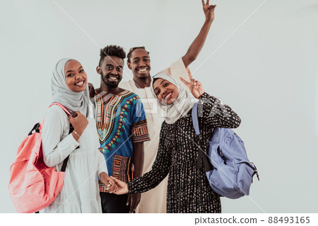 Group of happy african students having conversation and team meeting working together on homework girls wearing traidiional sudan muslim hijab fashion Group of happy african students having conversation and team meeting working together on homework girls wearing traidiional sudan muslim hijab fashion 88493165